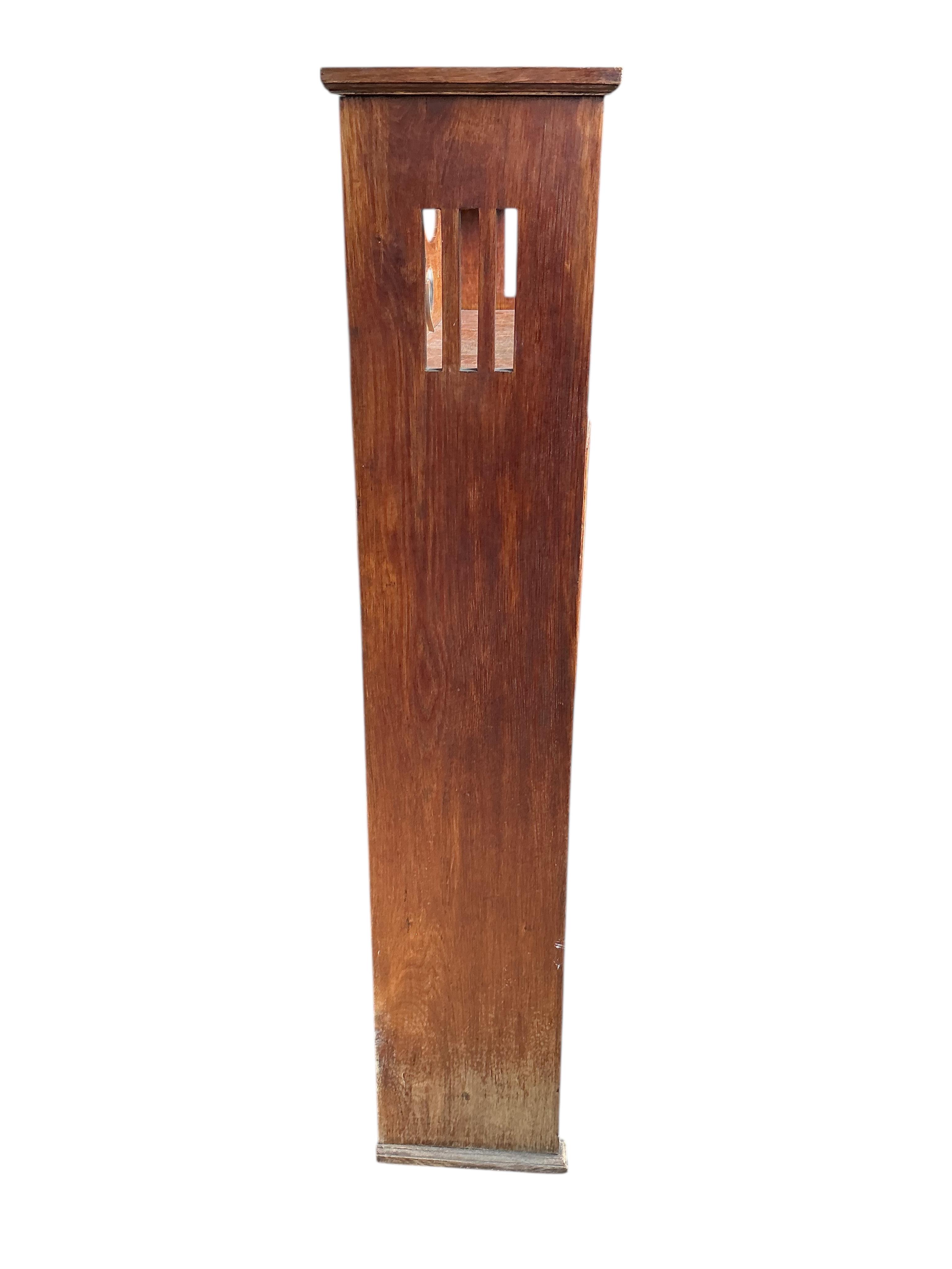 An Arts & Crafts oak open bookcase with stained leaded glass doors, width 108cm, depth 24cm, height 137cm
